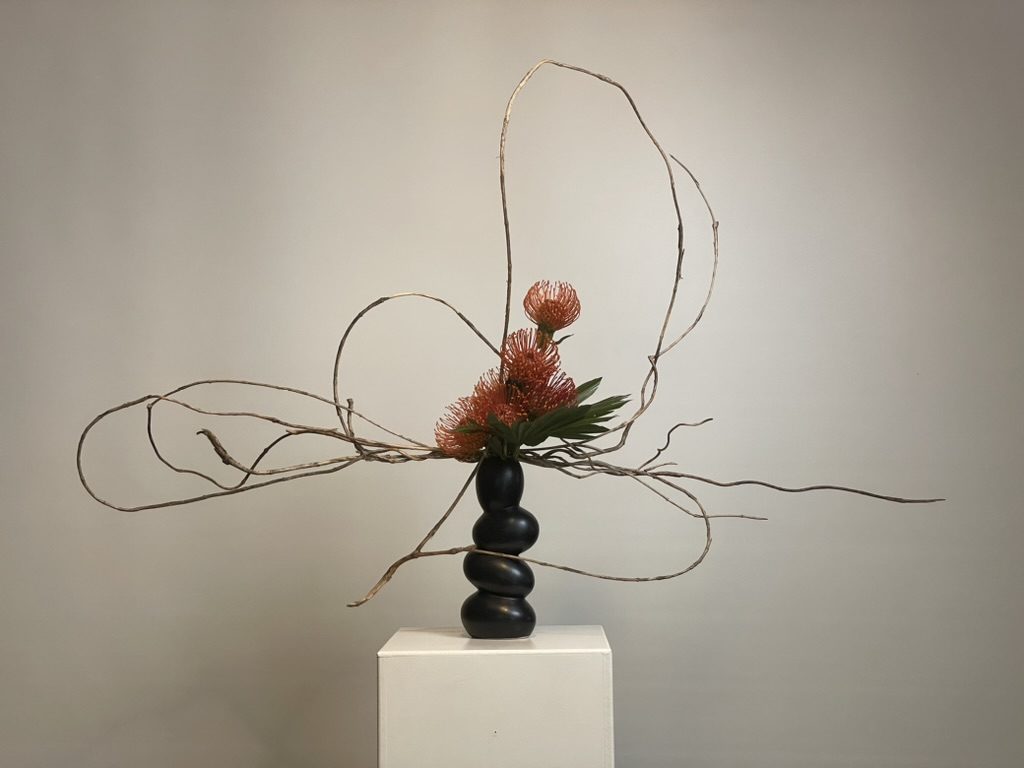 Pincushion protea, palm leaf & creeper branches