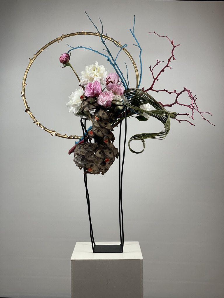 Paeonia, dried sansevieria, bark & a gilded canopy ring